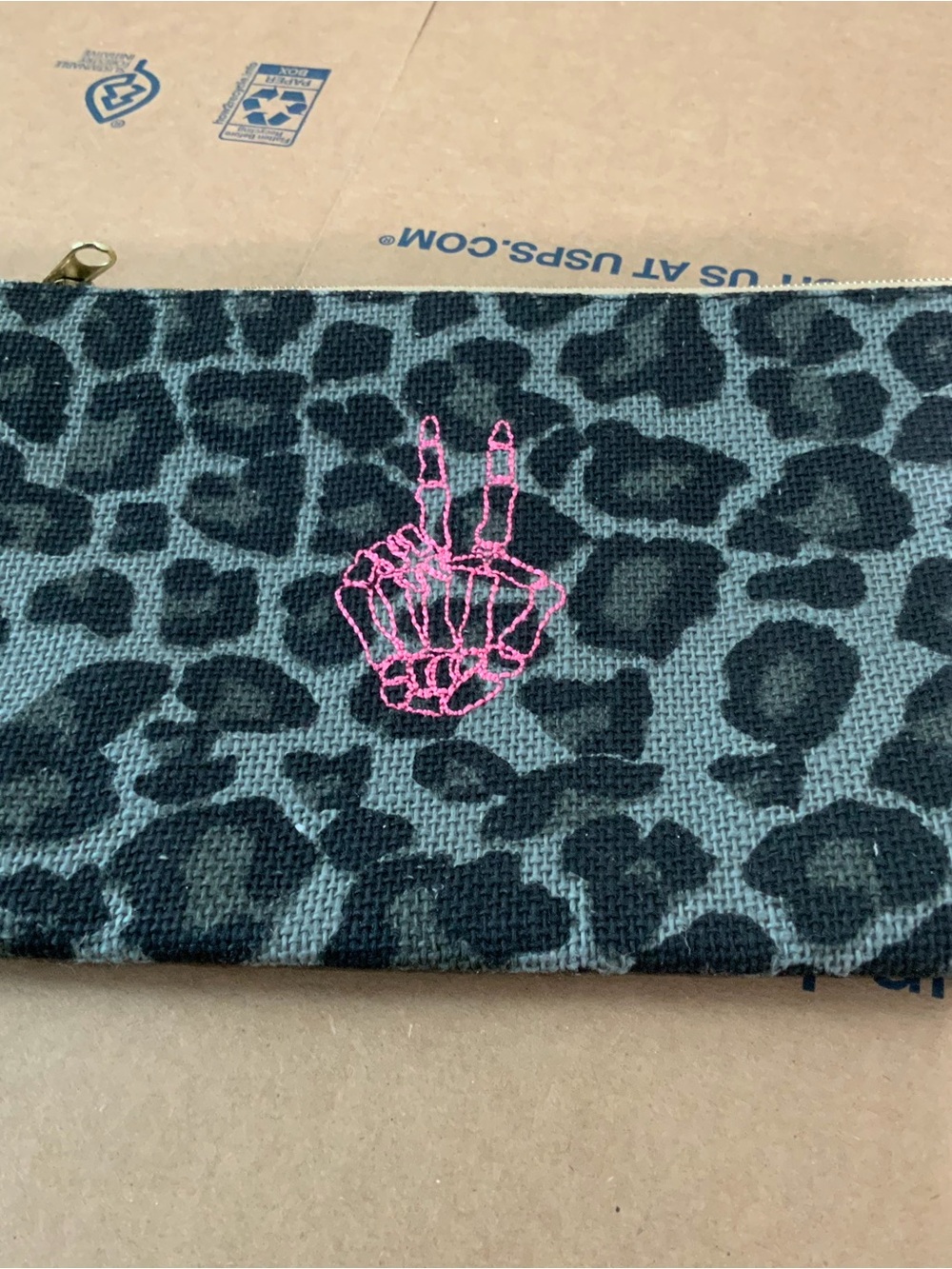 Leopard Print Zip Pouch with Pink Skeleton Hand Detail